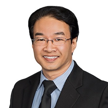 Dato’ Fong Swee Kiang in a dark suit and tie against a clean light grey background.