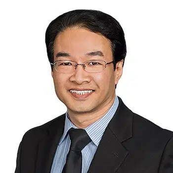 Dato’ Fong Swee Kiang in a dark suit and tie against a clean light grey background.