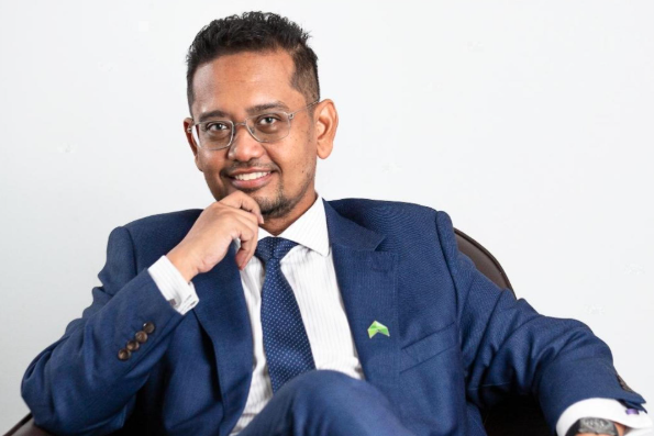 kamaruk a muhamed, founder and Group CEO of Aerodyne Group is seated on a chair, displaying a composed and professional demeanor.