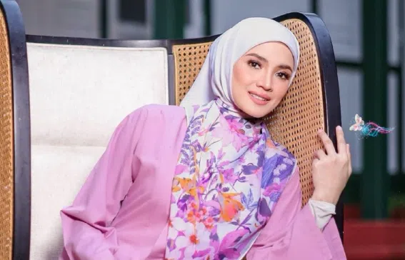 Nur Fazura in a pink outfit and floral hijab