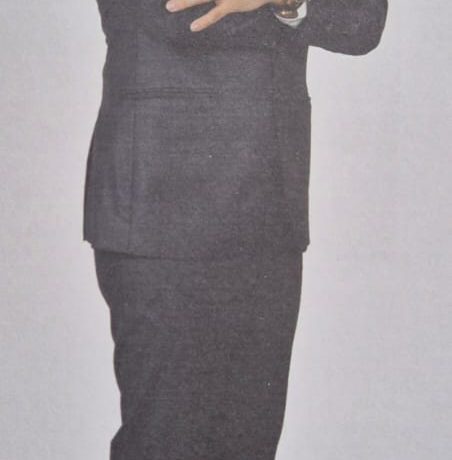 Full-body photo of Ng Shun Ming (Frank) standing with his arms crossed.